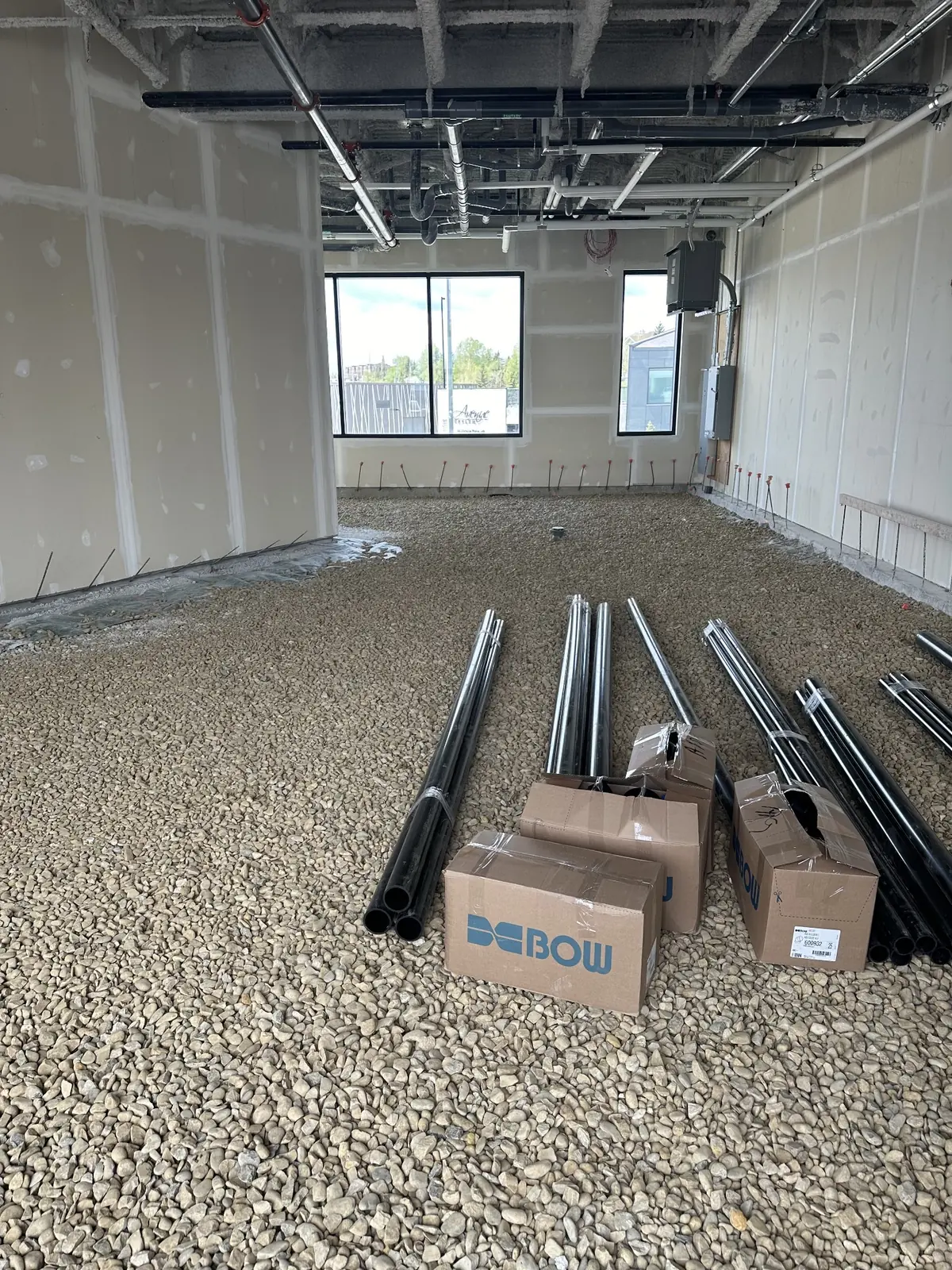 Commercial plumbing materials staged for a tenant improvement rough-in
